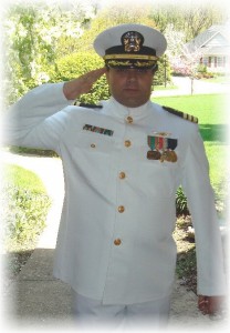 Anti-NAU Dr. Andrew J. Moulden smartly salutes while wearing the purloined uniform of a United States Naval Officer.